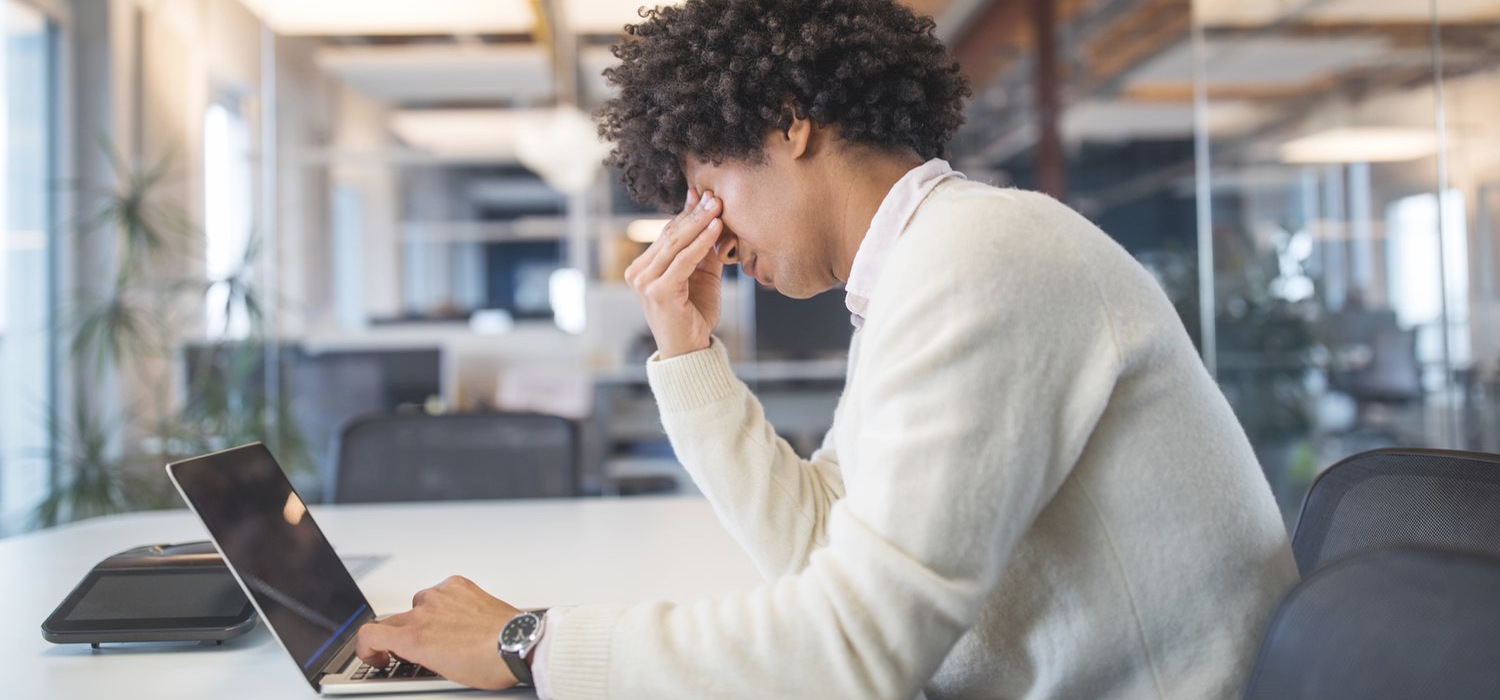 Labour and Loonie struggles in Canada causing a male employee to stress over his computer.